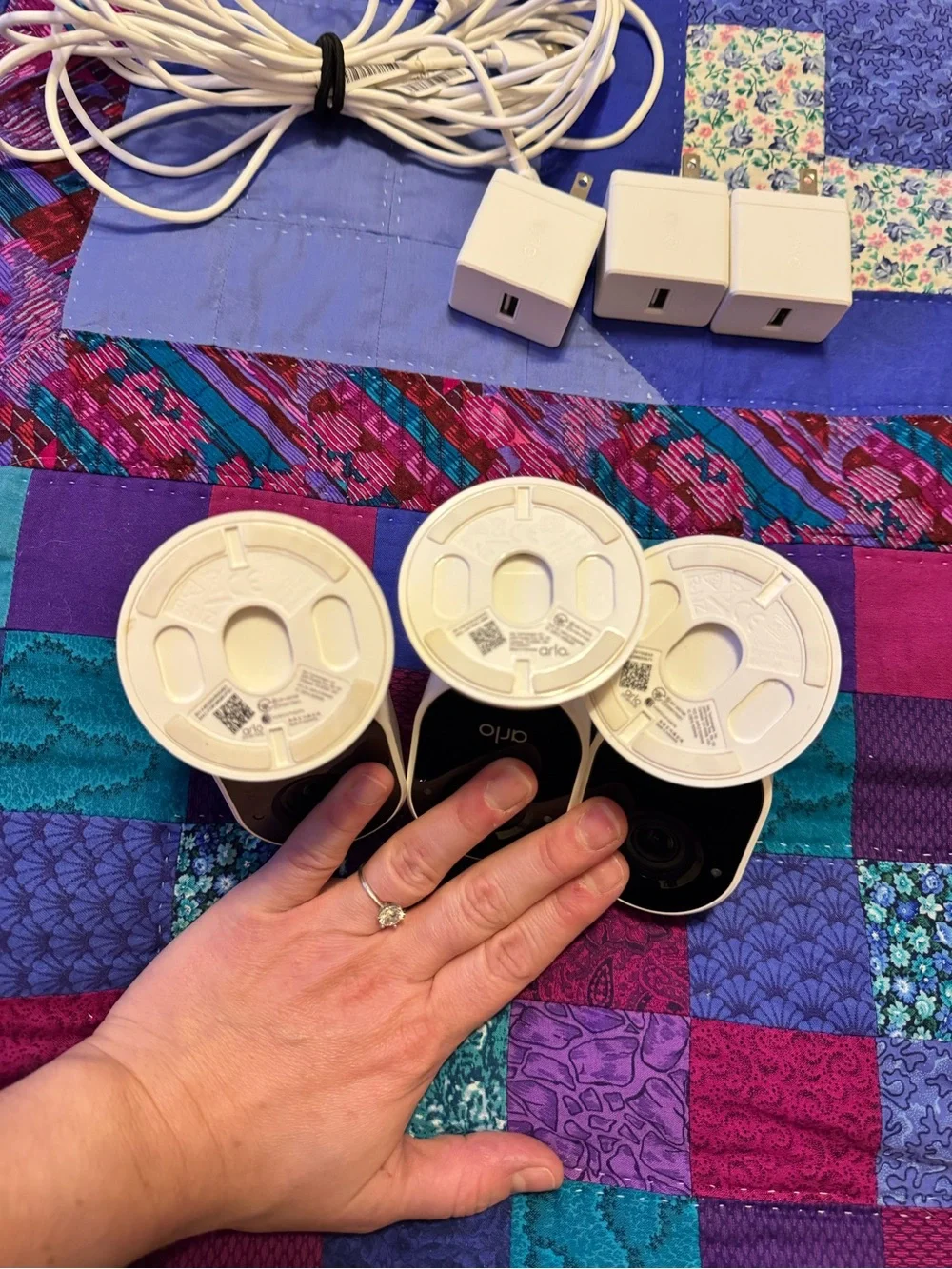 Arlo White Security Camera 3-Pack with Chargers Indoors